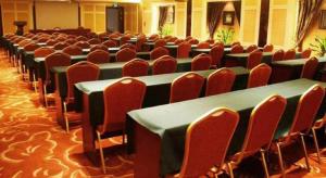 a row of tables and chairs in a room at Metropark Hotel in Huludao +232 photos