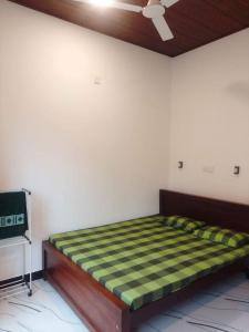 Ένα ή περισσότερα κρεβάτια σε δωμάτιο στο Ceylon Green Gate Hotel +6 φωτογραφίες