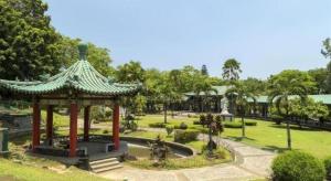 a gazebo in a park with a fountain at Time Travellers Hotel in Manila