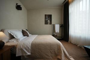 Ένα ή περισσότερα κρεβάτια σε δωμάτιο στο 山上有池民宿 +10 φωτογραφίες