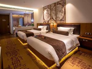 Ένα ή περισσότερα κρεβάτια σε δωμάτιο στο James Joyce Coffetel· Wuhan Wangjiawan Taojialing Metro Station +19 φωτογραφίες