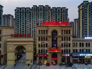 a view of a city with tall buildings at Shell Hotel Taixing Huangqiao Town Dinghui Road in Hengxiang