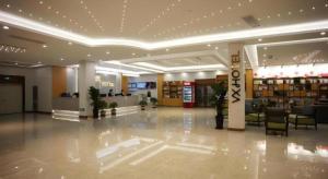 a lobby of a shopping center with a store at GreenTree Inn Heze Shan County New Bus Station in Shan