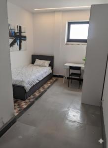 Ένα ή περισσότερα κρεβάτια σε δωμάτιο στο Résidence les 4 voisins