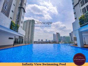 a view of the cityscape from the swimming pool of a building at Space Residency Johor Bahru near KSL City Mall by Cityscape in Johor Bahru +28 photos