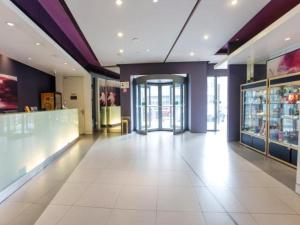 a large room with a large white tile floor in a store at Jinjiang Inn Changzhou West Xinqiao in Changzhou