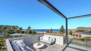 a view of the ocean from the balcony of a house at Omaroo House - Views Over Copa Beach in Copacabana +13 photos