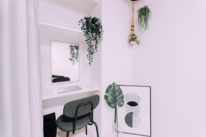 a white room with a chair and a mirror at Compact Loft 9 Studio 001 with Gym Namba in Wada