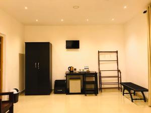 TV a/nebo společenská místnost v ubytování Hotel Eden Garden