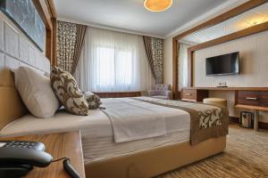 Кровать или кровати в номере City Hotel Residence