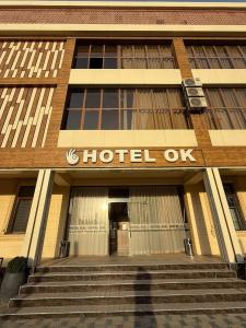 a building with the sign of a hotel at Hotel OK in Tashkent +50 photos