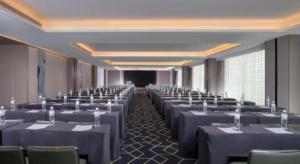 a room with rows of tables and chairs at Echeng Hotel Nanning the Mixc Convention in Nanning