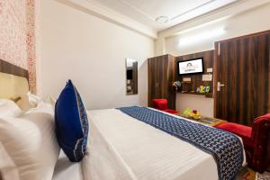 Postel nebo postele na pokoji v ubytování FabHotel Airport Sinon