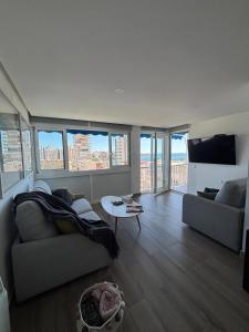 a living room with a couch and a tv at The luxury suite in Alicante