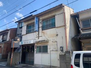 a building with a sign on the side of it at hamanocho Ap in Shimminatomachi