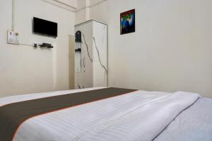 Postel nebo postele na pokoji v ubytování Hotel O Krishna Executive + 26 fotografií