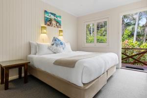 Postel nebo postele na pokoji v ubytování Lorhiti Apartments