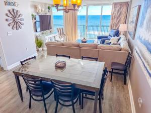 a living room with a table and a couch at Ashworth 905 in North Myrtle Beach