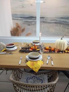 a table with a candle and a pumpkin on it at Dharmia in Almodóvar del Río