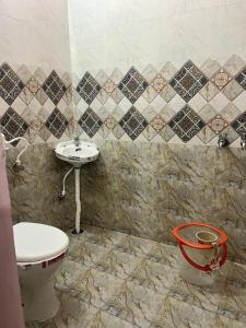 a bathroom with a toilet and a sink at Mahadev Home Stay !! Best Homestay Near Chandigarh Int'l Airport !! in Chandigarh Airport