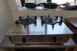 Η κουζίνα ή μικρή κουζίνα στο 貸切ゲストハウス みなと家