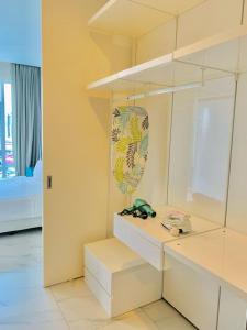 a room with a desk with glasses on it at PLATINUM Suites KLCC By AR Hospitality in Kuala Lumpur