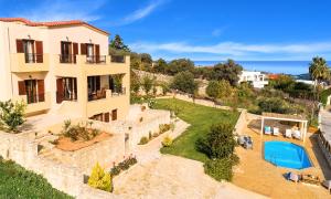 an aerial view of a house with a swimming pool at Ferienhaus Für 16 Personen In Episkopi, Kreta West Kreta in Episkopí- Rethimno