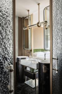 a bathroom with two sinks and a large mirror at Fairmont Xiamen in Xiamen
