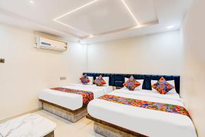 Postel nebo postele na pokoji v ubytování FabHotel Malva