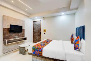 Postel nebo postele na pokoji v ubytování FabHotel Malva