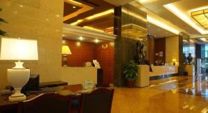 a lobby with a desk with a lamp on it at Metropolitan Hotel in Sima +185 photos