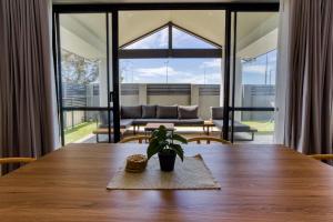 a table with a potted plant sitting on top of it at Casa Al Mare in Busselton