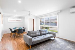 a living room with a couch and a table at Rye Retro Modern Remix in Rye