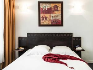 Postel nebo postele na pokoji v ubytování Aparthotel Adagio Access Toulouse Jolimont