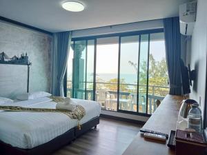 Ένα ή περισσότερα κρεβάτια σε δωμάτιο στο Pimpimarn Hotel +40 φωτογραφίες