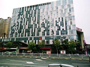 a large building on the side of a street at Metropolo, Jinjiang, Wanda Plaza in Jinjiang
