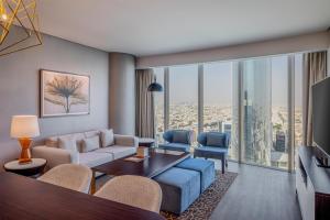 a living room with a couch and a table at Hilton Riyadh Olaya in Riyadh