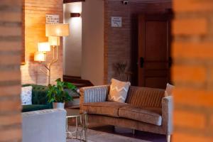a living room with a couch and a table at DWO Rioja Wine Hotel in Cenicero