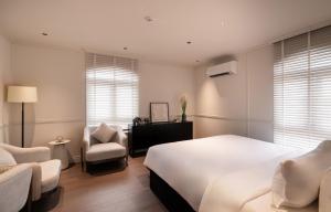 Postel nebo postele na pokoji v ubytování AMANA Boutique Hotel - Than Van Nhiep