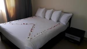 Postel nebo postele na pokoji v ubytování Mousa Coast Hotel & Spa