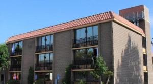 a large brick building with a red roof at Alhambra Hotel in Alhambra