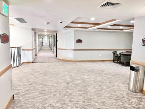 an empty hallway in a office building with a lobby at Relaxing Double Queen Mountain Getaway Near Park City & Sundance Ski Resorts - 2066 in Mound City
