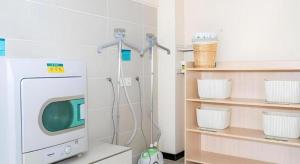 a hospital room with a tv and a machine at City Comfort Inn Beiliu Bus Terminal in Beiliu +135 photos