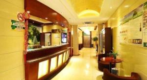 a lobby of a restaurant with a long hallway at GreenTree Inn Shanghai Gongkang Road Branch in Jiangwan