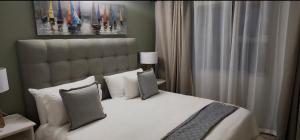 Ένα ή περισσότερα κρεβάτια σε δωμάτιο στο Sunset Heights 23 Coastal Sanctuary +9 φωτογραφίες