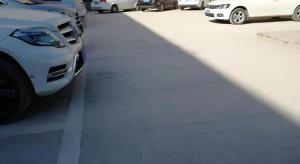 a row of parked cars in a parking lot at Jinjiang Inn Select Xuzhou Suining Middle Yuanfu Road in Suining