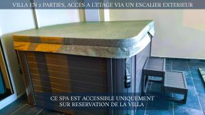 a kitchen with a counter top on top of it at Le Margaret Holidays in La Plaine des Cafres