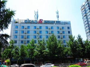 a building with a bike on the top of it at Jinjiang Inn Hefei Huizhou Avenue in Hefei