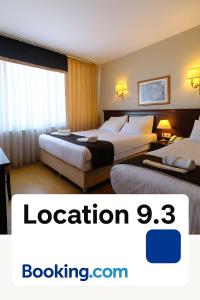 a hotel room with two beds in a room at Taksim Pera Rose Hotel & Spa - Istiklal Street in Istanbul