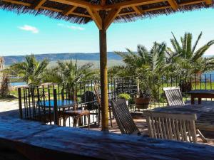 a table and chairs with a view of the ocean at Casa Entre Armonías in Zahara de los Atunes